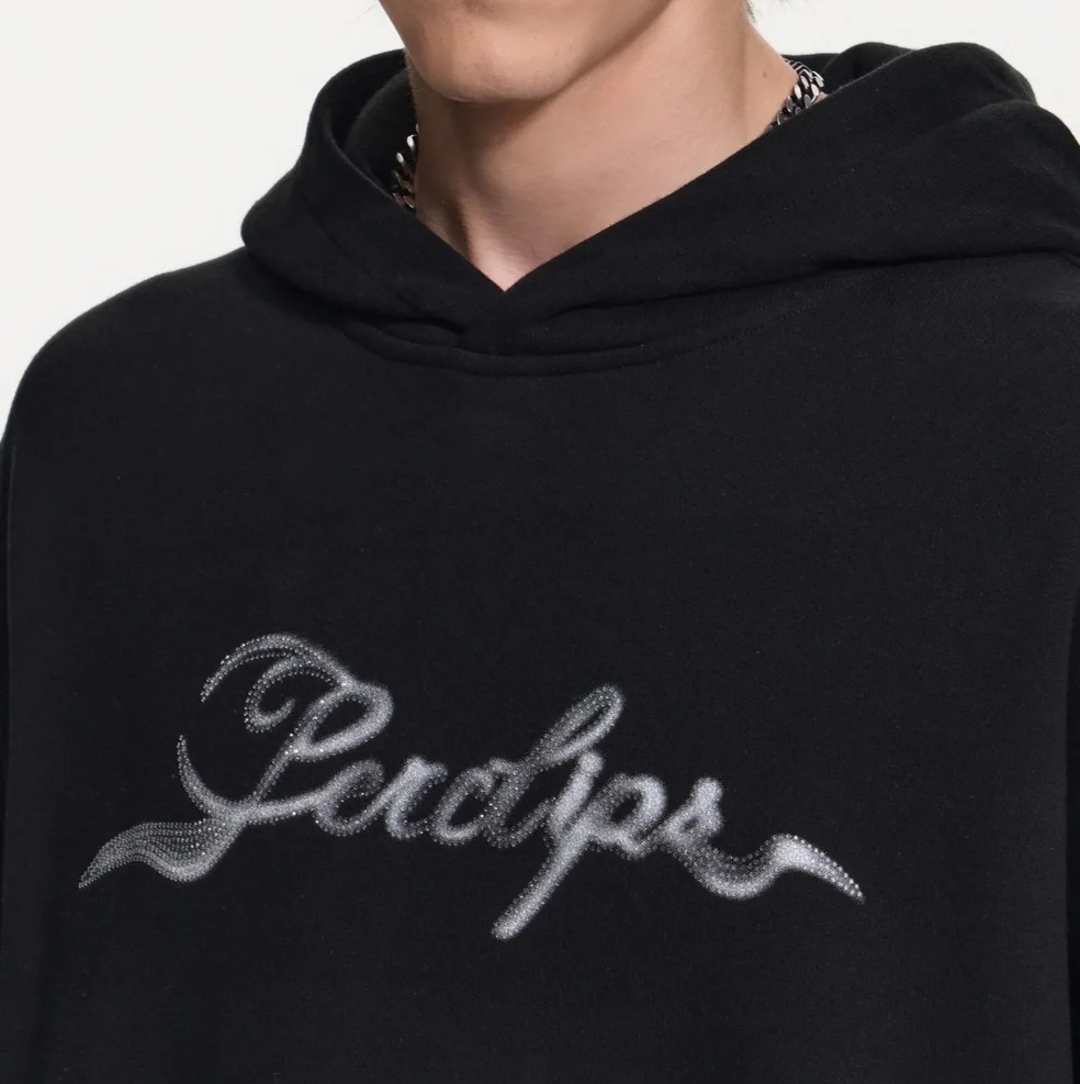 Black rhinestone embellishment on custom apparel
