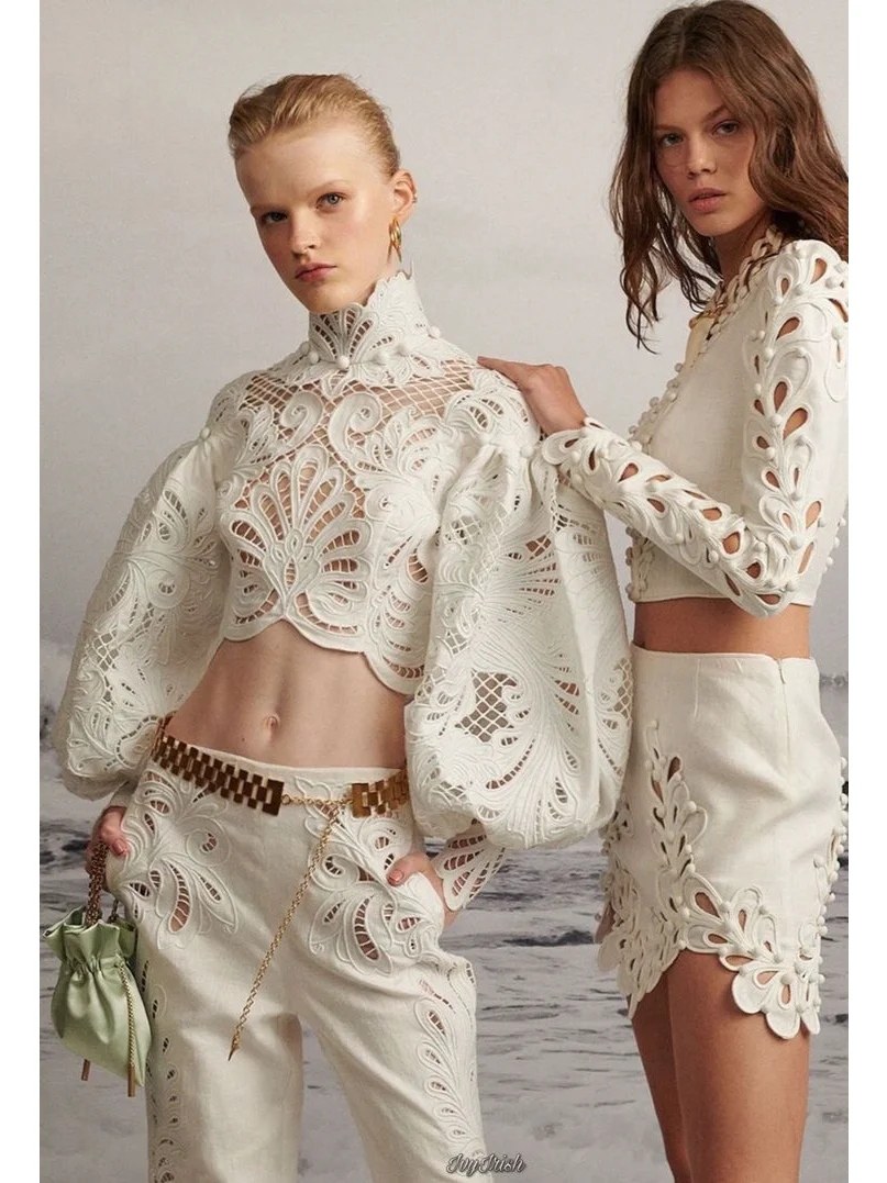 Blouse with eyelet embroidery decoration