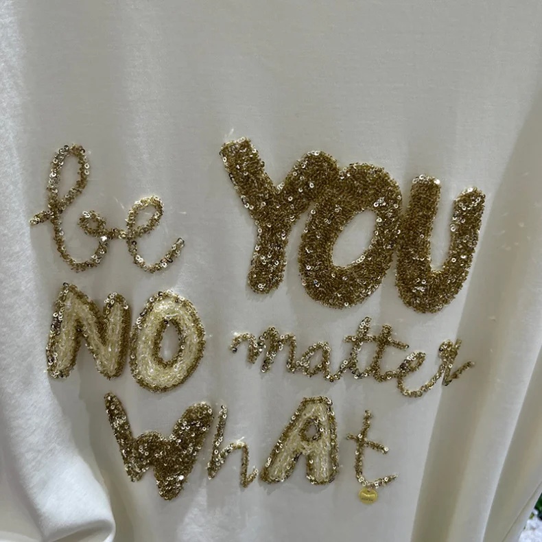 Fabric with sequin embroidery for custom apparel