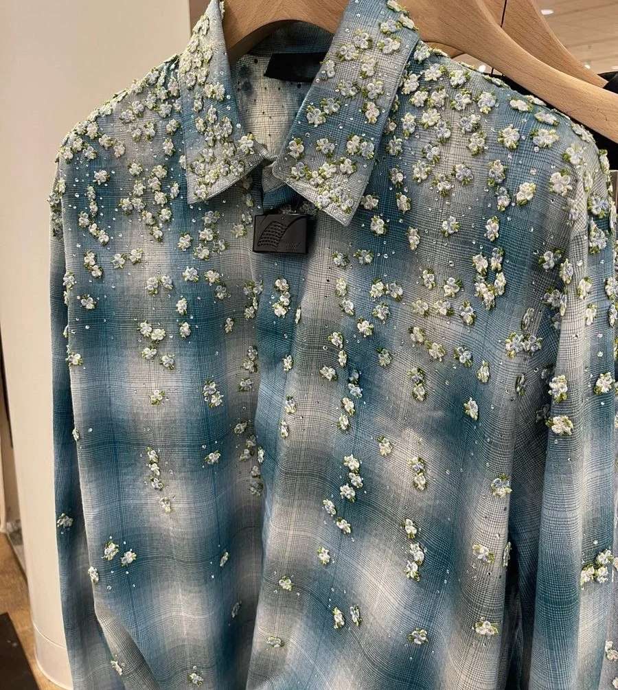Rhinestone application on custom garment embellishment