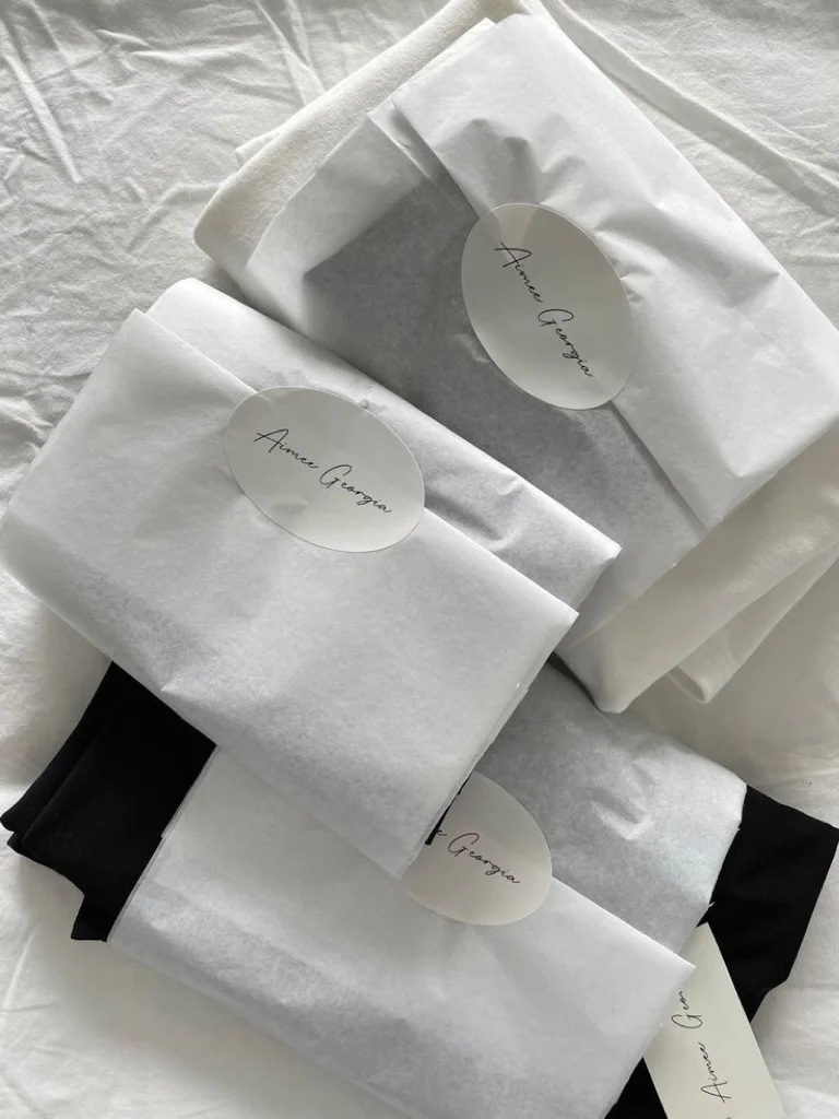 Branded tissue paper for apparel packaging solutions