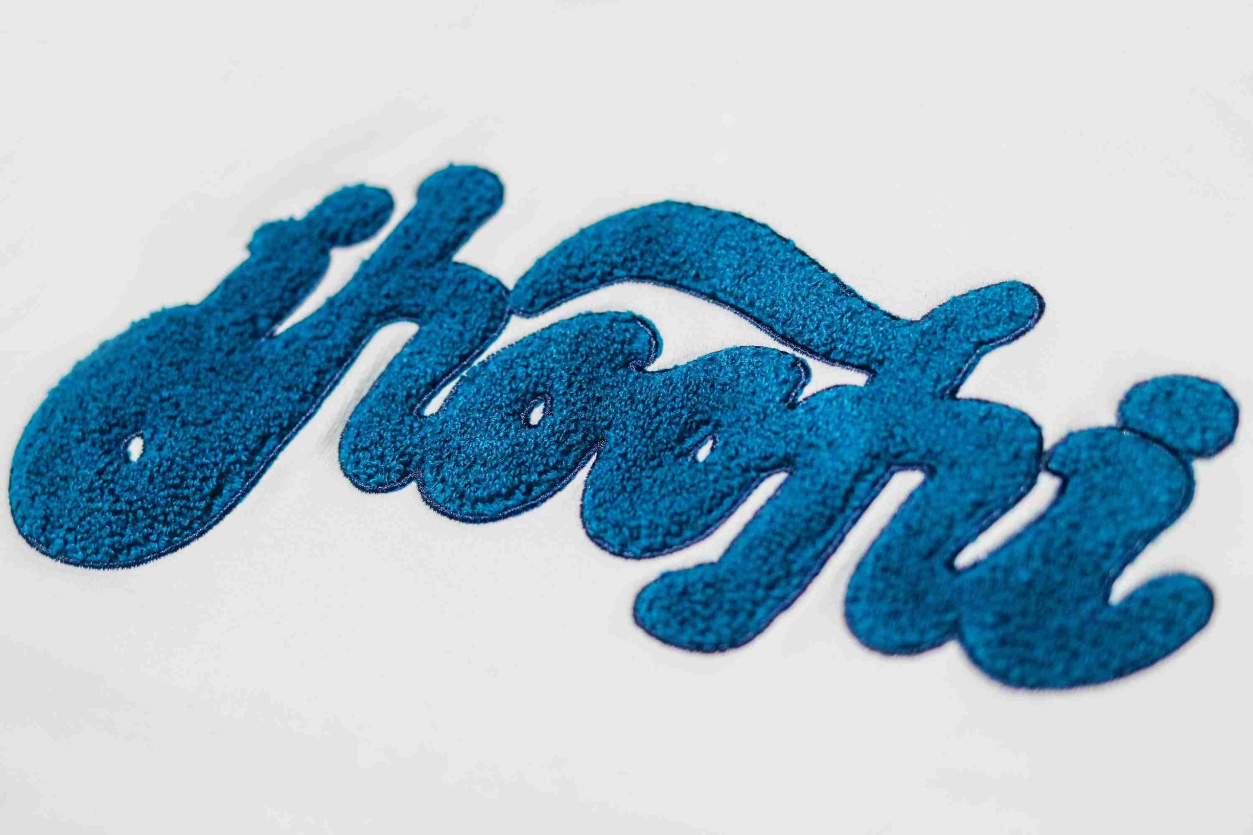 Towel material for embroidery on apparel