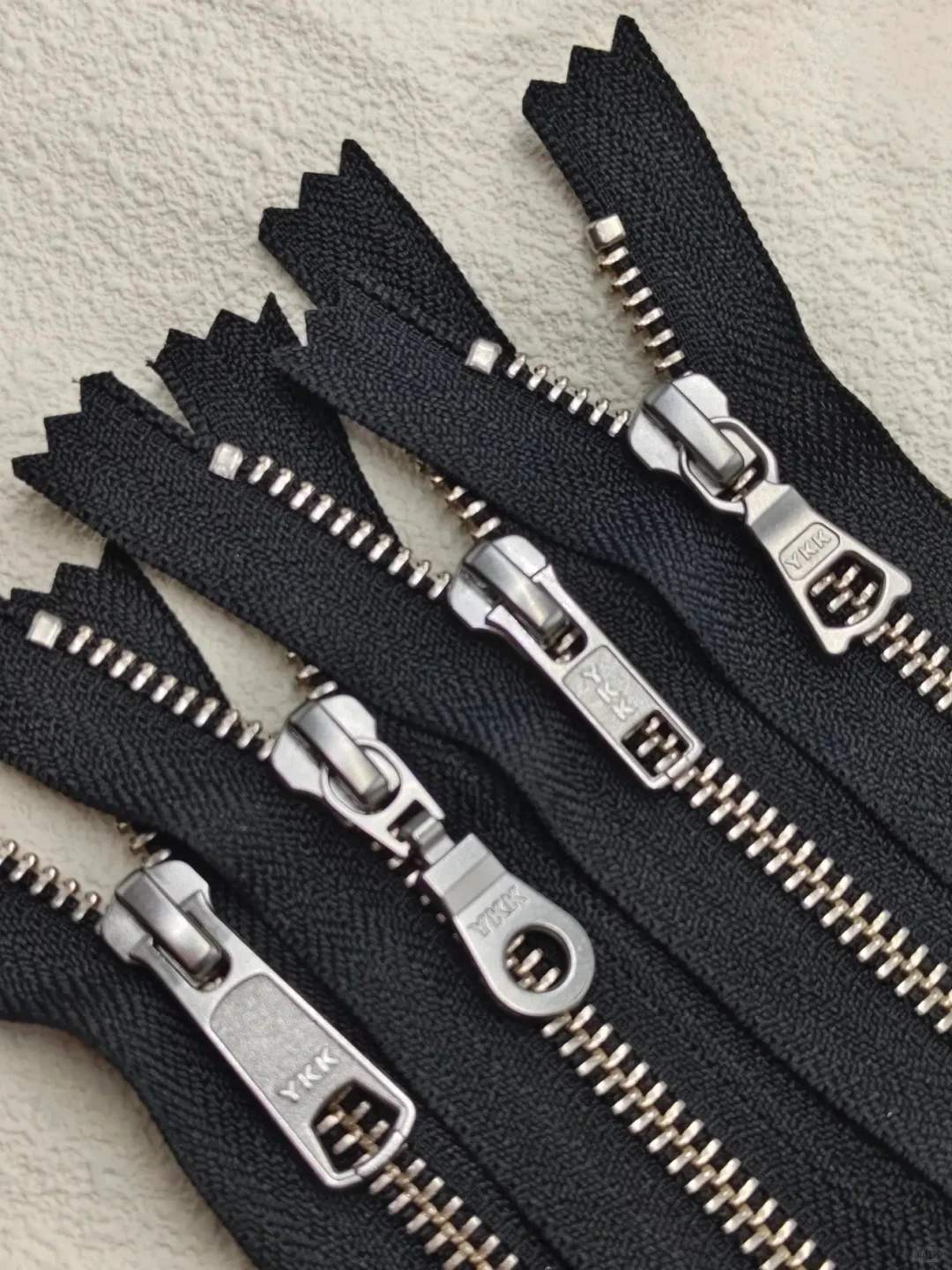 Custom zippers for apparel manufacturing and garment production